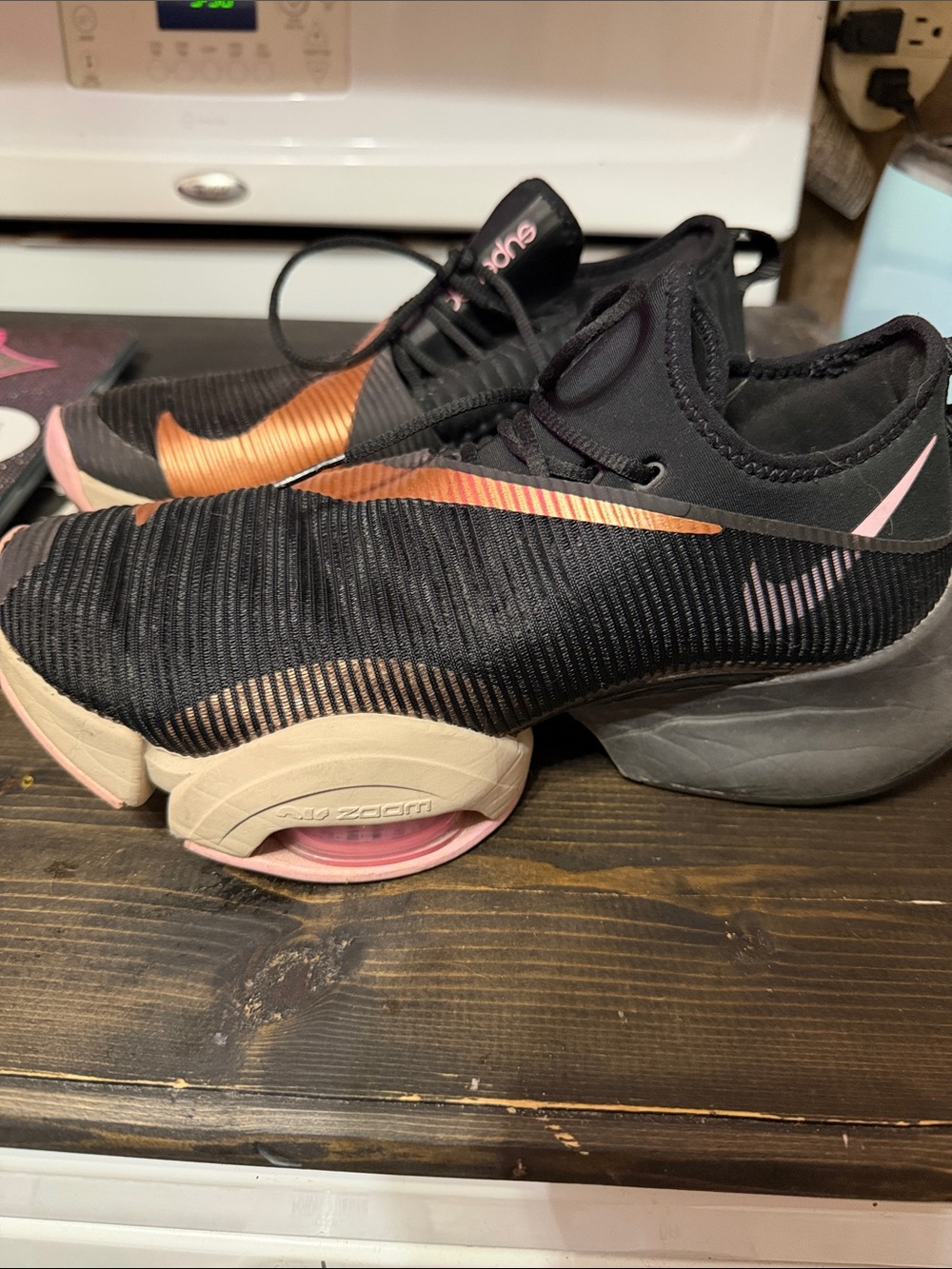 Nike Women's Black Running Shoes with Rose Gold Swoosh and Pink Accents